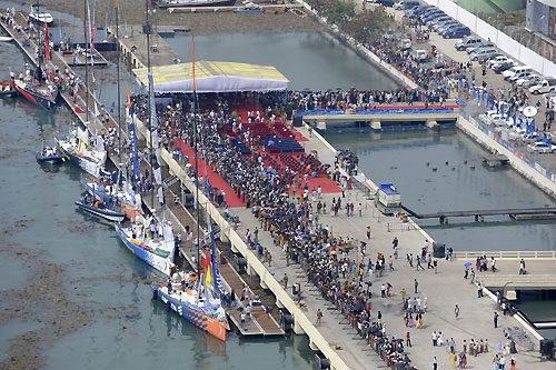 With crowds gathered on the dockside, the fleet of Volvo Open 70's make their way to the start line for leg 3 of the Volvo Ocean Race, from Cochin, India to Singapore. Photo copyright Rick Tomlinson / Volvo Ocean Race.