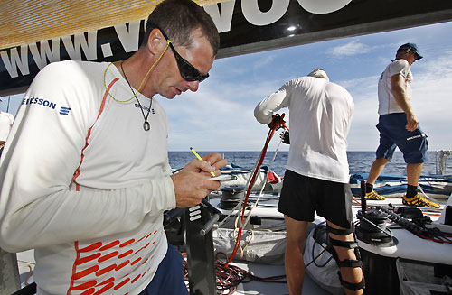 Skipper Anders Lewander making notes onboard Ericsson 3, on leg 3 of the Volvo Ocean Race from India to Singapore. Photo copyright Gustav Morin / Ericsson 3 / Volvo Ocean Race.