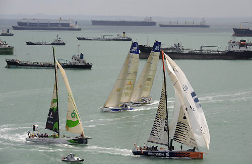 The start of leg 4 of the Volvo Ocean Race, from Singapore to Qingdao, China. In the background are some of the vast number of ships anchored outside this busy global maritime crossroad. Photo copyright Rick Tomlinson / Volvo Ocean Race.