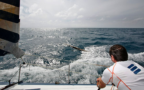 A log floats past Ericsson 3, one of the many hazardous debris the fleet have to deal with, on leg 4 of the Volvo Ocean Race, from Singapore to Qingdao, China. Photo copyright Gustav Morin / Ericsson 3 / Volvo Ocean Race.