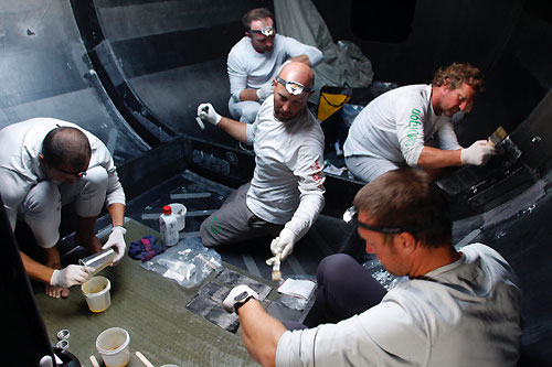 Tom Braidwood leads the crew in repairing damage sustained in 50 knot winds, on leg 4 of the Volvo Ocean Race, from Singapore to Qingdao, China. Photo copyright Guo Chuan / Green Dragon Racing / Volvo Ocean Race.
