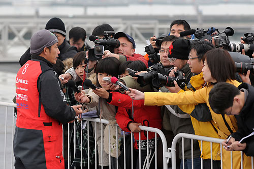Green Dragon's Media Crew Member Guo Chuan, the only Chinese Sailor in the Volvo Ocean Race 2008-09, is interviewed by the Chinese media after the Qingdao In-Port Regatta. Photo copyrightDave Kneale / Volvo Ocean Race.