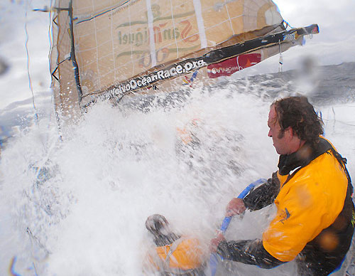 David Vera driving while a wave submerges the whole boat, in rough weather onboard Telefonica Blue, on leg 5 of the Volvo Ocean Race. Photo copyright Gabriele Olivo / Telefonica Blue / Volvo Ocean Race.
