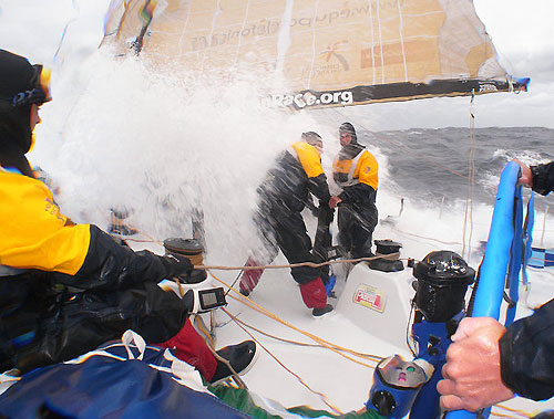Xabier Fernandez is hit by a wave while grinding with Jonathan Swain, in rough weather onboard Telefonica Bue, on leg 5 of the Volvo Ocean Race. Photo copyright Gabriele Olivo / Telefonica Blue / Volvo Ocean Race.