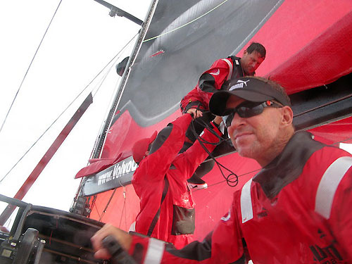 Bowman Jerry Kirby standing on Skipper Ken Read's shoulders whilst working on the mainsail en route to Rio De Janeiro in leg 5 of the Volvo Ocean Race. Photo copyright Rick Deppe / PUMA Ocean Racing / Volvo Ocean Race.