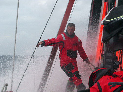 Helmsman / Trimmer Rob Greenhalgh (GB) drags a sailbag along the deck of PUMA in heavy weather during Leg 5 from Qingdao to Rio de Janeiro. Photo copyright Rick Deppe / PUMA Ocean Racing / Volvo Ocean Race.