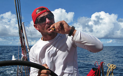 Sidney Gavignet smoking a cigar as PUMA Ocean Racing cross the equator, on leg 5 of the Volvo Ocean Race. Photo copyright Rick Deppe / PUMA Ocean Racing / Volvo Ocean Race.