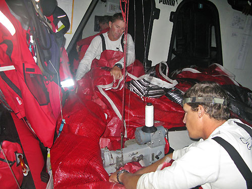 Ken Read and Justin Ferris repair the damaged J2 as we approach the scoring gate at New Zealand, on leg 5 of the Volvo Ocean Race, from Qingdao to Rio de Janeiro. Photo copyright Rick Deppe / PUMA Ocean Racing / Volvo Ocean Race.