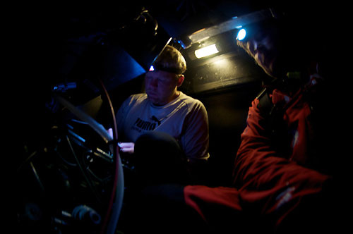 Casey Smith and Andrew Cape working in the engine box, onboard PUMA Ocean Racing, on leg 5 of the Volvo Ocean Race, from Qingdao to Rio de Janeiro. Photo copyright Rick Deppe / PUMA Ocean Racing / Volvo Ocean Race.