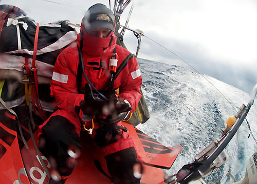 Casey Smith putting gloves on before grinding as PUMA Ocean Racing, hit rough weather in the Southern Ocean, on leg 5 of the Volvo Ocean Race, from Qingdao to Rio de Janeiro. Photo copyright Rick Deppe / PUMA Ocean Racing / Volvo Ocean Race.