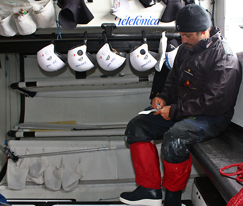 Jordi Calafat writing the job list, onboard Telefonica Blue, on leg 5 of the Volvo Ocean Race, from Qingdao to Rio de Janeiro. Photo copyright Gabriele Olivo / Telefonica Blue / Volvo Ocean Race.