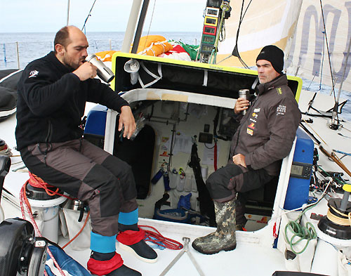Xabier Fernandez and Bouwe Bekking having a cup of tea while waiting for some weather to arrive, onboard Telefonica Blue, on leg 5 of the Volvo Ocean Race, from Qingdao to Rio de Janeiro. Photo copyright Gabriele Olivo / Telefonica Blue / Volvo Ocean Race.