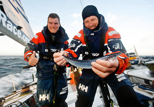 Eivind Melleby and Arve Roaas catch a fish, onboard Ericsson 3, on leg 5 of the Volvo Ocean Race, from Qingdao to Rio de Janeiro. Photo copyright Gustav Morin / Ericsson 3 / Volvo Ocean Race.