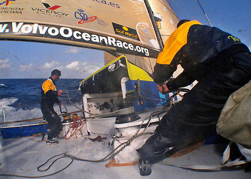 Jordi Calafat trimming the staysail while Pablo Arrarte is grinding the daggaboard up, on leg 6 of the Volvo Ocean Race, from Rio de Janeiro to Boston. Photo copyright Gabriele Olivo / Telefonica Blue / Volvo Ocean Race.