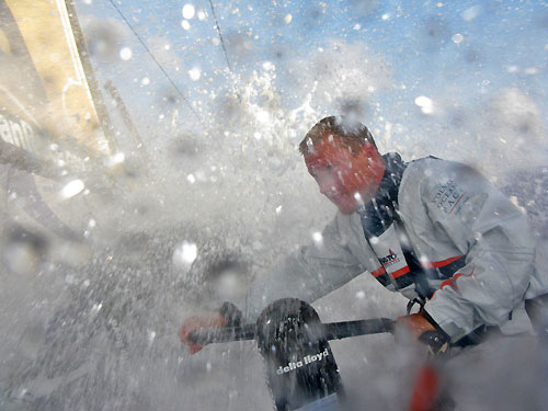 Day 8, heading north fast, 22 knots and 2,500 to go, beautiful sunny day and a lot of water on deck. Delta Lloyd trimmer Ed van Lierde is grinding the main and having a blast with every wave hitting him, on leg 6 of the Volvo Ocean Race, from Rio de Janeiro to Boston. Photo copyright Sander Pluijm / Team Delta Lloyd / Volvo Ocean Race.