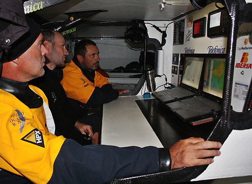 Very tense moments at the navigation station. Bouwe Bekking, Tom Addis and Jordi Calafat looking at the weather, on leg 6 of the Volvo Ocean Race, from Rio de Janeiro to Boston. Photo copyright Gabriele Olivo / Telefonica Blue / Volvo Ocean Race.