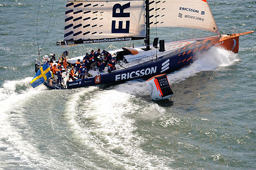 Ericsson 4 rounds the mark in the Boston pro-am race at Fan Pier. Photo copyright Rick Tomlinson / Volvo Ocean Race.