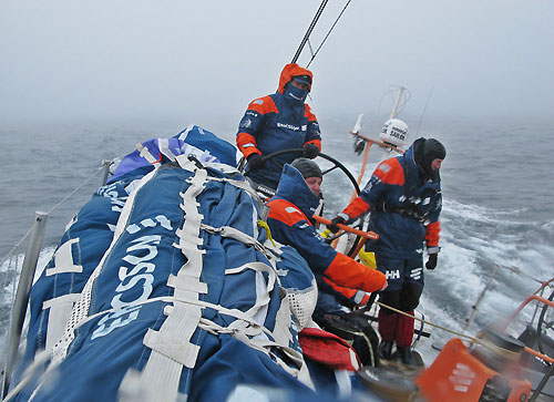Richard Mason helming in the cold misty conditions, on leg 7 from Boston to Galway. Photo copyright Gustav Morin / Ericsson 3 / Volvo Ocean Race.