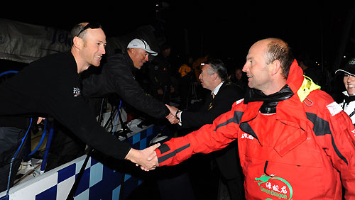 Tom Addis from Telefonica Blue, skippered by Bouwe Bekking (NED), is greeted by Green Dragon skipper Ian Walker. Telefonica Blue finished fourth in leg 7 from Boston to Galway, crossing the line at 02:42:25 GMT, May 24, 2009. Photo copyright Rick Tomlinson / Volvo Ocean Race.