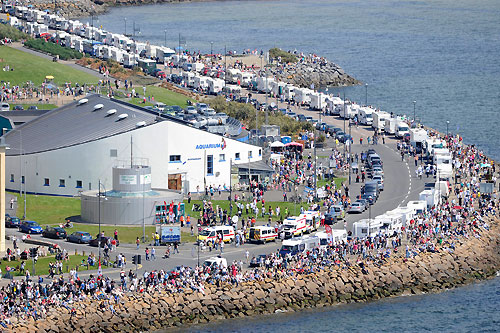 The endless line of camper vans parked along the shore reveal that many of the thousands of spectators gathered at Salthill to watch the In-port race in Galway Bay, had travelled from far and wide for the Volvo Ocean Race. Photo copyright Rick Tomlinson / Volvo Ocean Race.