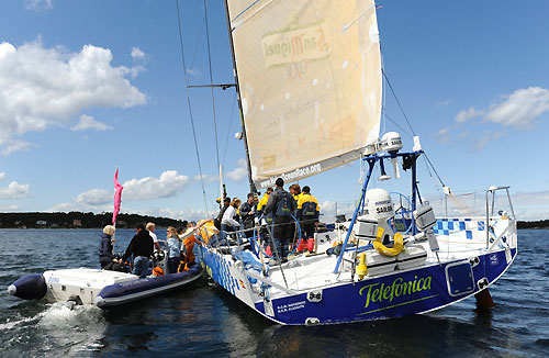 Wives and girlfriends of the crew climb onboard Telefonica Blue at Sandhamn, after crossing the finishing line for leg 9. Photo copyright Rick Tomlinson / Volvo Ocean Race.