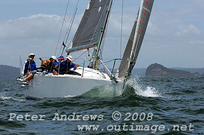 John Groves' Sydney 32 Reality ploughing into the Pacific Ocean with Lion Island in the background after the start of the Pittwater to Pittwater Ocean Race.