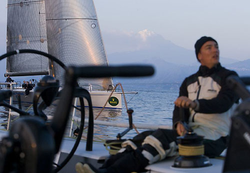 Andres Soriano's Alegre sneaks up on Jim Swartz's Moneypenny at dusk, with Mt Etna in the background, during the Rolex Middle Sea Race 2008. Photo copyright ROLEX and Daniel Forster.