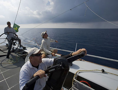 Keeping an eye on a passing storm cell on Jim Swartz's STP65 Moneypenny, during the Rolex Middle Sea Race 2008. At the base of the cloud a small waterspout can be seen. Photo copyright ROLEX and Daniel Forster.