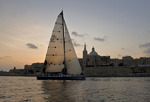 Line Honours winner Andres Soriano's Alegre crossing the finishing line at 07:20 am at Valletta, Malta, during the Rolex Middle Sea Race 2008. Photo copyright ROLEX and Kurt Arrigo.