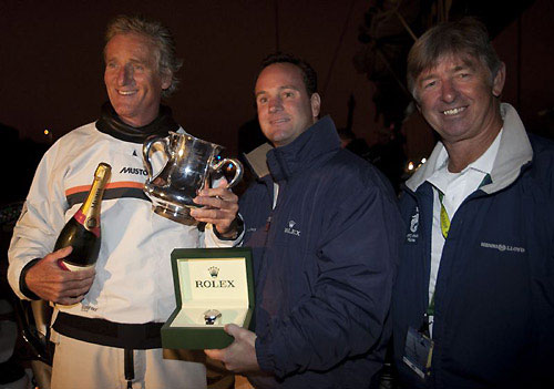 Mike Slade, owner of ICAP Leopard, receives a Rolex Yacht-Master Timepiece and the Erroll Bruce Cup trophy for his Line Honours win, at Sutton Harbour, Plymouth, during the Rolex Fastnet Race 2009. Photo copyright Rolex - Carlo Borlenghi.