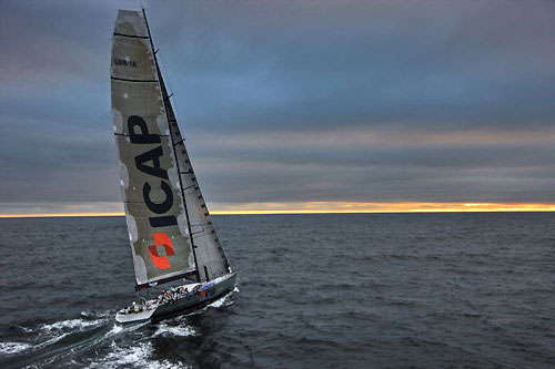 Mike Slade's ICAP Leopard at dusk heading for Fastnet Rock, during the Rolex Fastnet Race 2009. Photo copyright Rolex, Carlo Borlenghi.