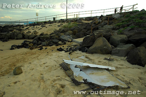 Carbon fibre from Shockwave 5, washed up at Towradgi Point. In 1881, the ship Queen of Nations ran aground at this location and the timbers remain buried in the sand close by. Photo copyright Peter Andrews.