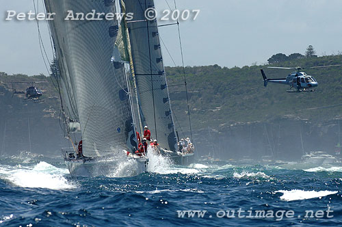 Wild Oats XI being chased out of Sydney Harbour by Mike Slade's Leopard, during the Rolex Sydney Hobart 2007. Photo Copyright Peter Andrews, Outimage
