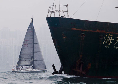 Joachim Isler and Andrew Taylor's Mills 41 Ambush behind Hong Kong harbour traffic, after the start of the Rolex China Sea Race 2010. Photo copyright Daniel Forster, Rolex.