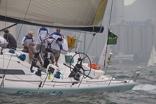 Geoff Hill's TP52 Strewth leaving Hong Kong Harbour after the start of the of the Rolex China Sea Race 2010. Photo copyright Daniel Forster, Rolex.