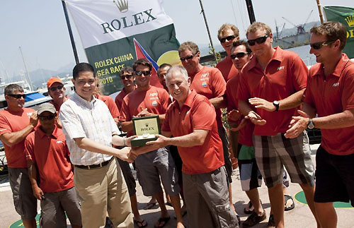 John de Luna from Rolex Philippines presents a Rolex Yacht-Master to Line Honours winner Neil Pryde, owner and skipper of Hi Fi as his crew look on, after their arrival in Subic Bay, completing the Rolex China Sea Race 2010. Photo copyright Daniel Forster, Rolex.