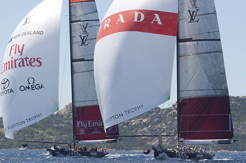 Louis Vuitton Trophy, La Maddalena, Sardegna. Race day four saw plenty of action in the steady 18 knots of wind. Luna Rossa defeated Emirates Team New Zealand. Luna Rossa and Emirates in gybing duel. Photo copyright Bob Grieser, Outsideimages NZ and Louis Vuitton Trophy.