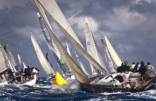 Fleet reaches the windward mark with Hubert Wargny's Swan 45 Axelles in the foreground, during the Giraglia Rolex Cup 2010. Photo copyright Rolex and Kurt Arrigo.