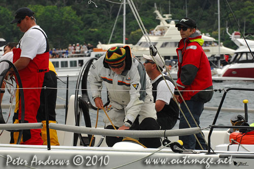 Owner Skipper of the Reichel Pugh 62 Limit, Alan Brierty wearing his favourite hat and sorting out some lines on deck, ahead of the start of the Rolex Sydney Hobart 2010. Photo copyright Peter Andrews, Outimage Australia.