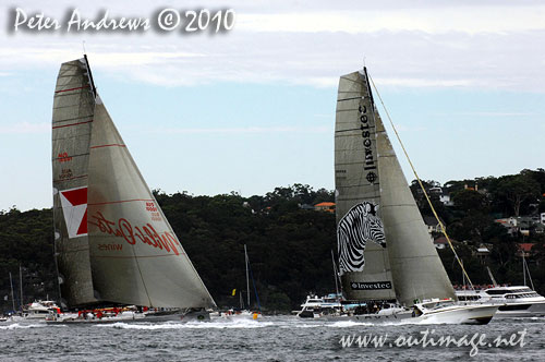 Sean Langman and Anthony Bell's Elliott Maxi Investec Loyal, just ahead of Bob Oatley's Wild Oats XI, after the start of the Rolex Sydney Hobart 2010. Photo copyright Peter Andrews, Outimage Australia.
