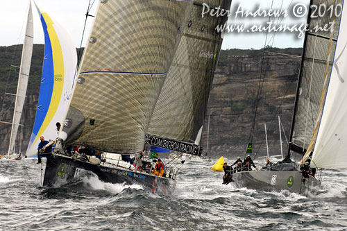 Ludde Ingvall's 90 foot maxi YuuZoo and Niklas Zennström’s Rán, outside the heads after the start of the Rolex Sydney Hobart 2010. Photo copyright Peter Andrews, Outimage Australia.