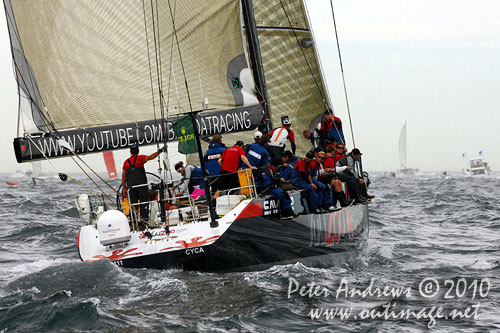 Ludde Ingvall's 90 foot maxi YuuZoo, outside the heads after the start of the Rolex Sydney Hobart 2010. Photo copyright Peter Andrews, Outimage Australia.