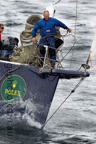 The bowman at work onboard Ludde Ingvall's 90 foot maxi YuuZoo, offshore Sydney after the start of the Rolex Sydney Hobart 2010. Photo copyright Howard Wright, IMAGE Professional Photography.