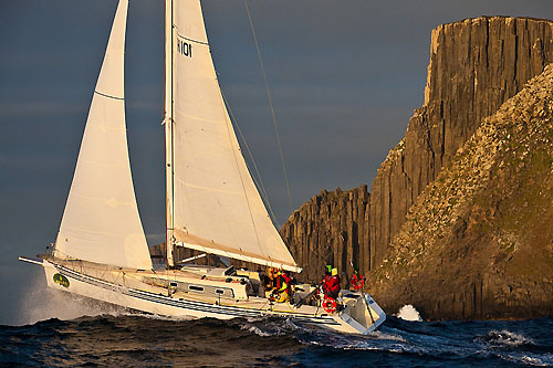 Angus Fletcher's Tevake II launches off a wave while rounding Tasman Island, during the Rolex Sydney Hobart Yacht Race. Photo copyright Rolex and Daniel Forster.