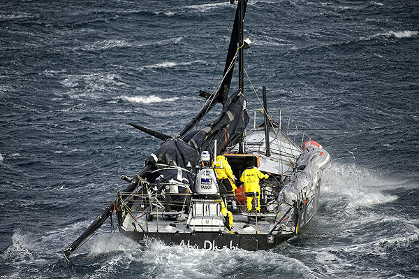 Abu Dhabi Ocean Racing's yacht Azzam, skippered by Britain's Ian Walker, returns to Alicante, Spain after the mast broke in rough weather on the first day of racing on leg 1 of the Volvo Ocean Race 2011-12. Photo Paul Todd/Volvo Ocean Race.