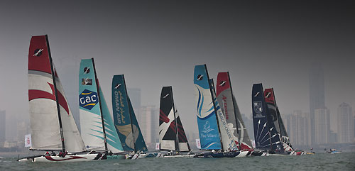 The fleet on day 2 racing close to city, during the Extreme Sailing Series 2011, Qingdao, China. Photo copyright Lloyd Images.