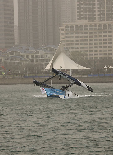 The Wave-Muscat capsize in race 2 on day 3, during the Extreme Sailing Series 2011, Qingdao, China. Photo copyright Sui Zhi Qiang, Lloyd Images.
