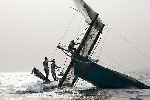 Oman Air, the 4th and final capsize of day 3, during the Extreme Sailing Series 2011, Qingdao, China. Photo copyright Lloyd Images.
