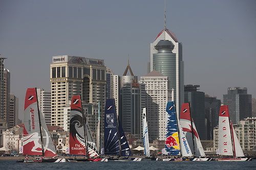 Fleet racing in front of Qingdao city skyline, during the Extreme Sailing Series 2011, Qingdao, China. Photo copyright Lloyd Images.