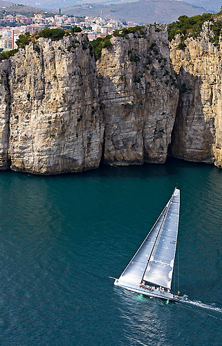 Andres Soriano’s Mills 68 Alegre with Sperlonga in the background, during the Rolex Capri Sailing Week and Rolex Volcano Race, Capri, Italy. Photo copyright Rolex and Carlo Borlenghi.